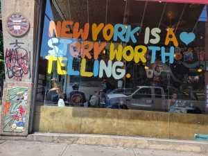 New York is a story worth telling painted on a window